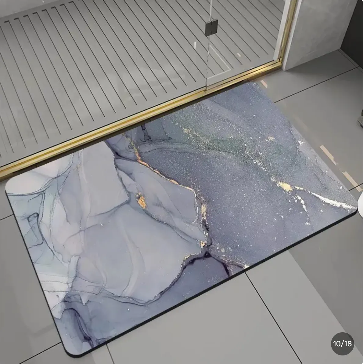 The Ondra Mat in front of a walk-in shower, in a bright bathroom